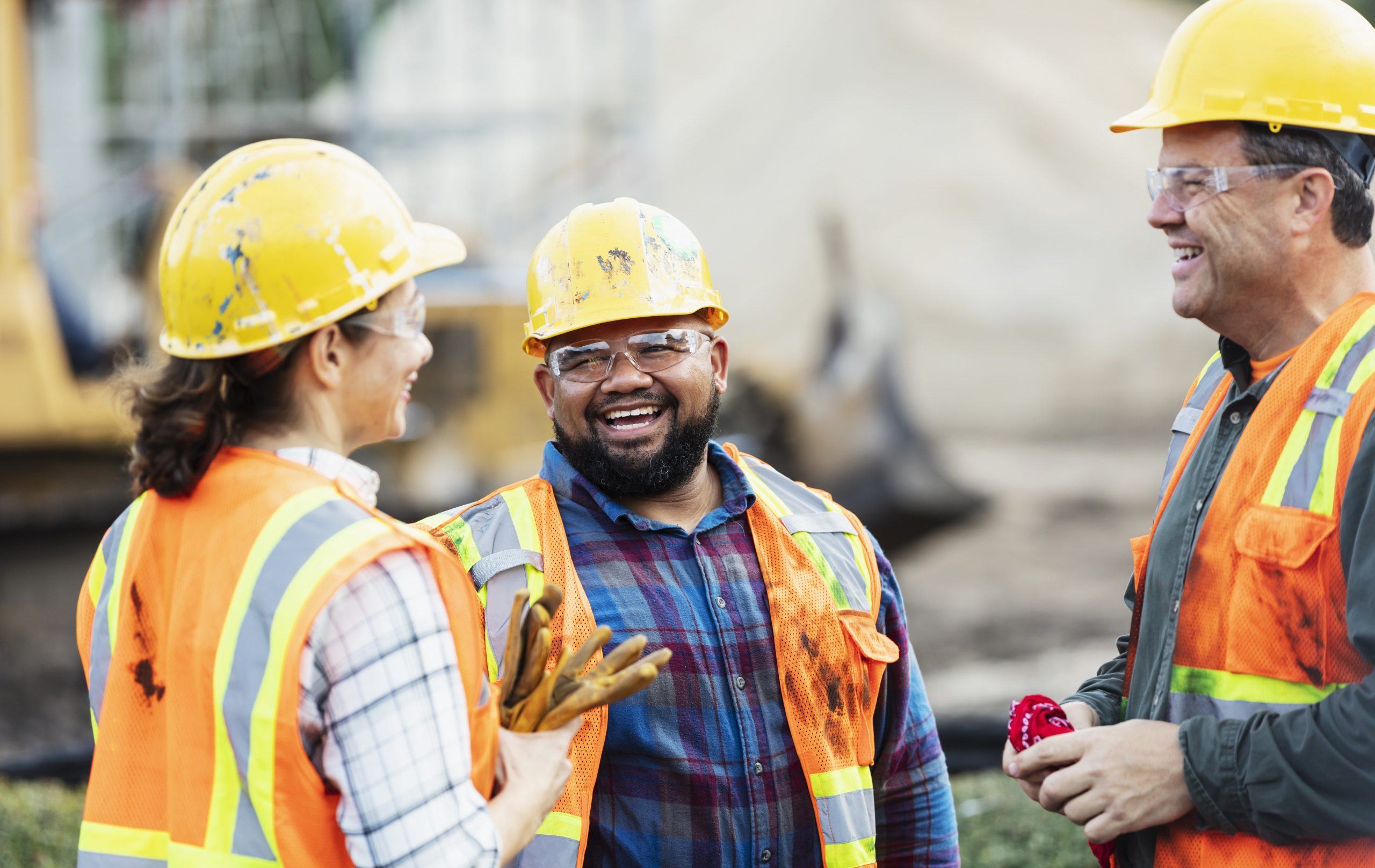 Three Multi Ethnic Construction Workers Chatting